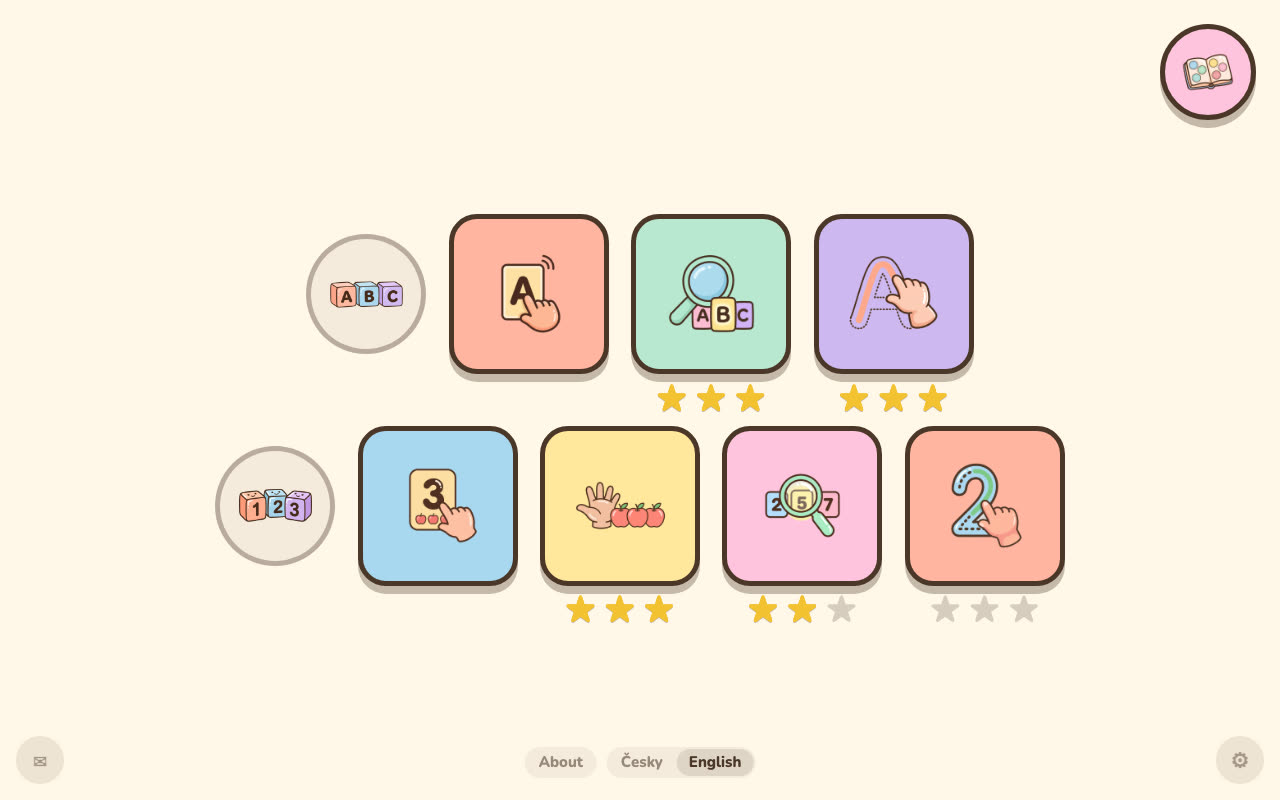 The game menu has pictures only; the Česky / English language switch is at the bottom